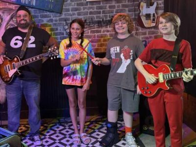 Coyote Bill with young musicians