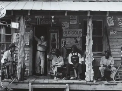 photo of men in appalachia relaxing on a store's front porch