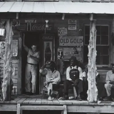 photo of men in appalachia relaxing on a store's front porch