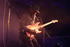 kent burnside playing guitar on stage