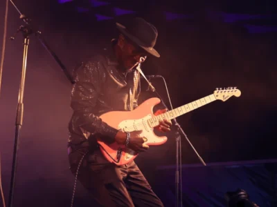 kent burnside playing guitar on stage