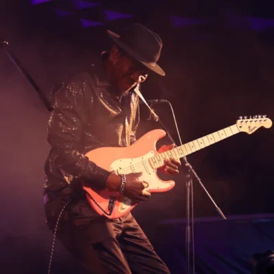 kent burnside playing guitar on stage